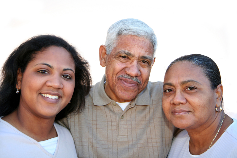 Photo of a older father, mother, and adult daughter