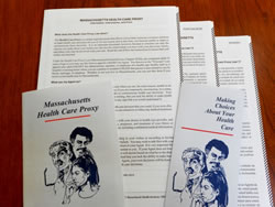 Photo of Health Care Proxy form in 3 languages, and two other publications